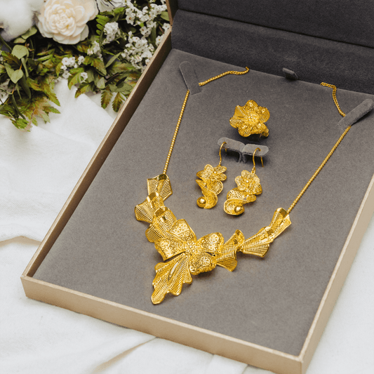 999 Pure Gold Statement Bow Earring featuring a bold yet feminine bow design in solid gold, perfect for standout style and elegant charm.