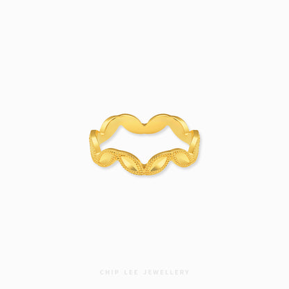 A gold wavy band ring with a textured beaded lower half, shown on a clean white background with the brand name 'CHIP LEE JEWELLERY' printed at the bottom.