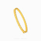 A gold bangle bracelet with a textured, ridged pattern, shown on a clean white background with a brand watermark at the bottom.