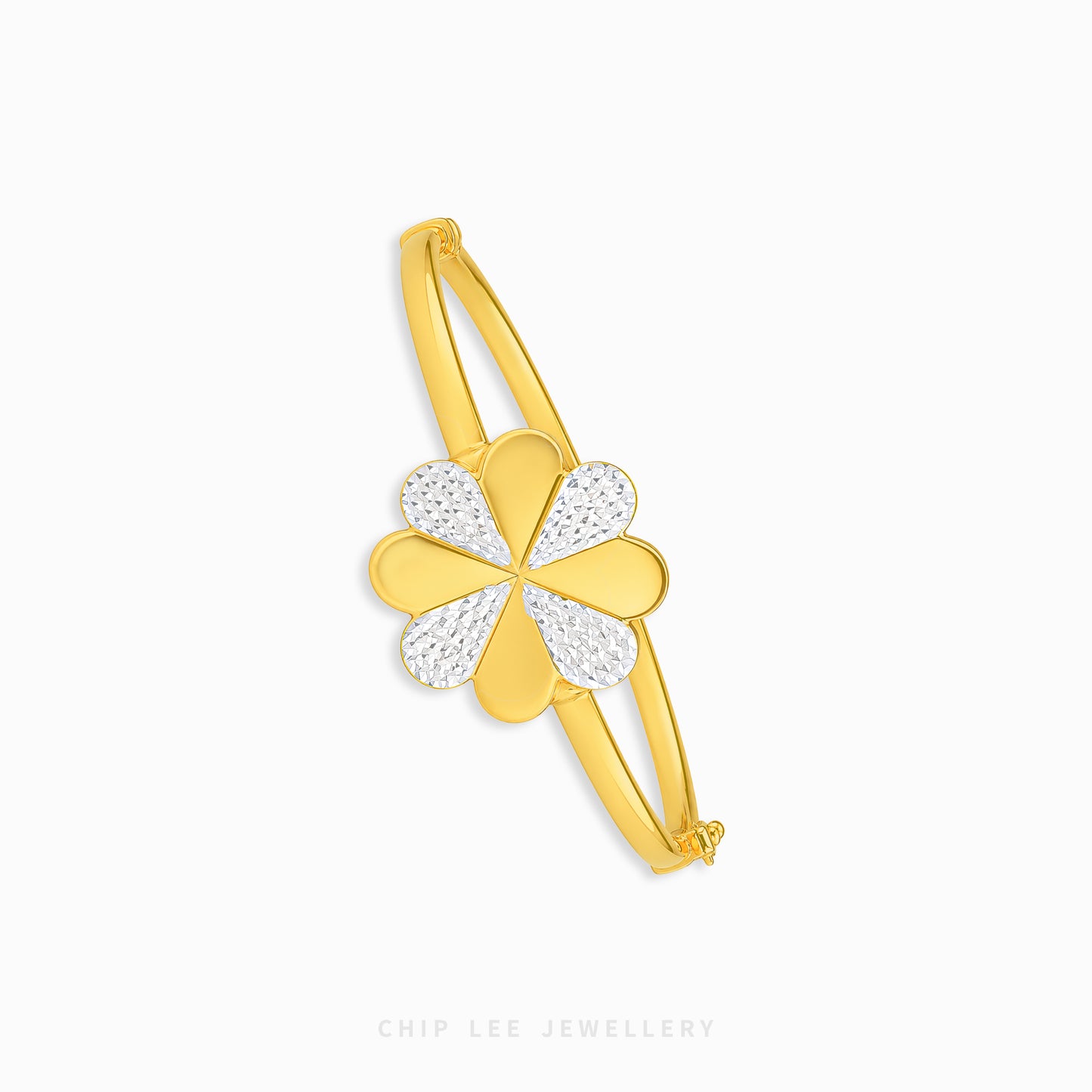 A gold-plated bangle bracelet featuring a four-leaf clover charm with two gold petals and two pavé-set clear stones on the other two petals, shown on a light gray background with 'CHIP LEE JEWELLERY' text at the bottom.