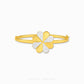 A gold-plated bangle bracelet featuring a four-leaf clover charm with two gold petals and two pavé-set clear stones on the other two petals, shown on a light gray background with 'CHIP LEE JEWELLERY' text at the bottom.