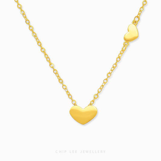 Chip Lee Double Heart Necklace. Certified 916 Gold (22K) pendant featuring an elegant double heart motif. Perfect symbol of love jewellery from Chip Lee SG.