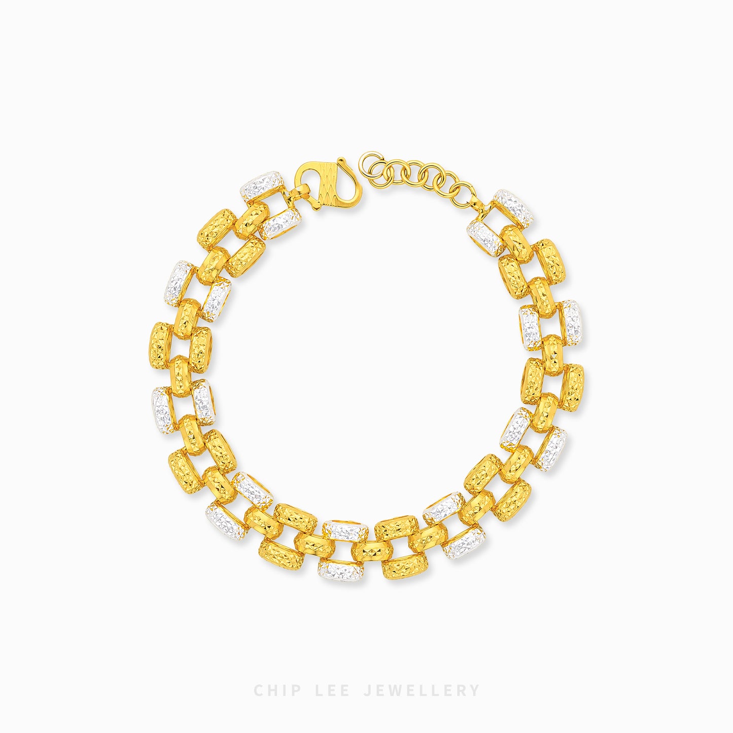A gold link bracelet with alternating textured yellow-gold links and clear crystal links, displayed on a clean white background with a brand watermark at the bottom.