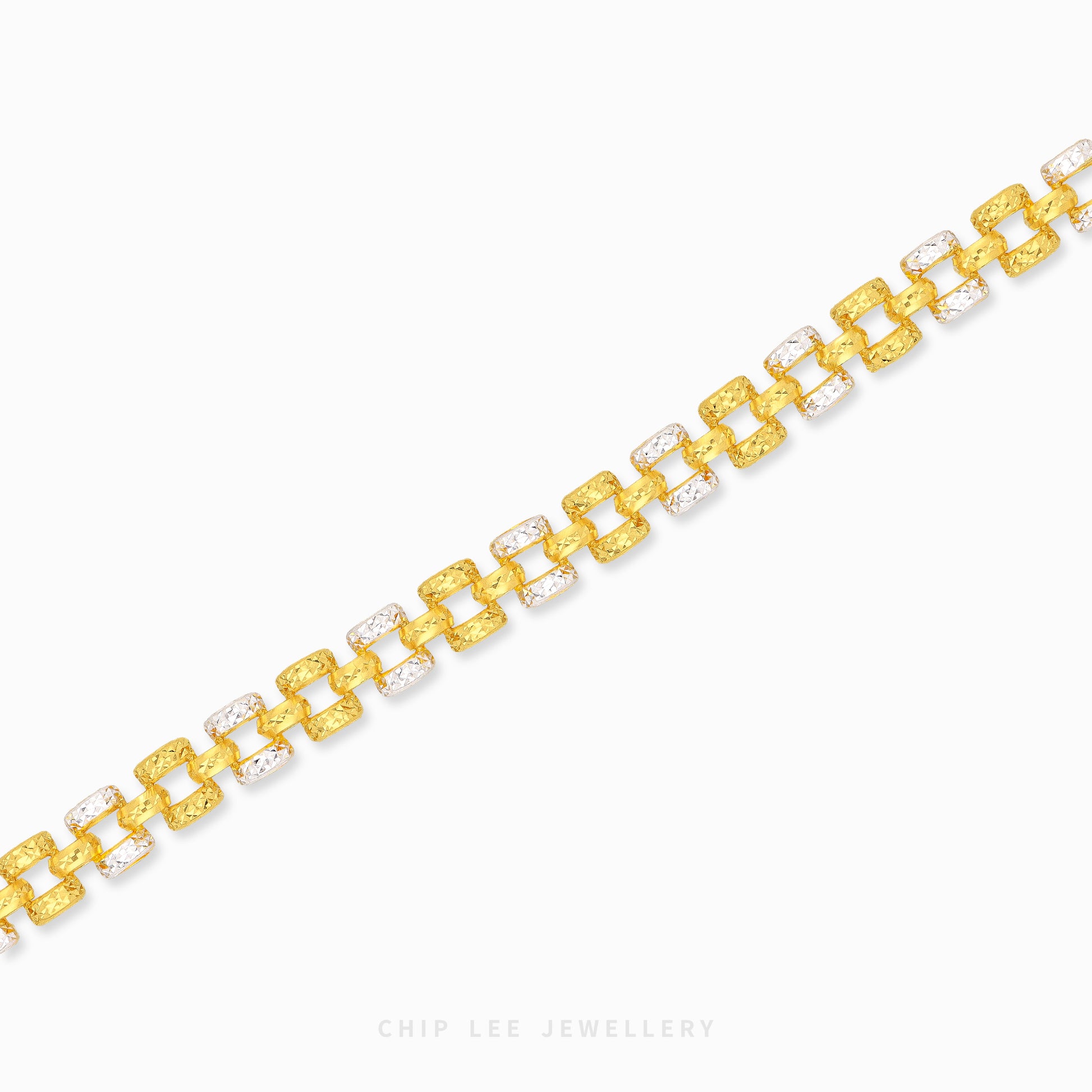 A gold link bracelet with alternating textured yellow-gold links and clear crystal links, displayed on a clean white background with a brand watermark at the bottom.