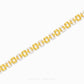 A gold link bracelet with alternating textured yellow-gold links and clear crystal links, displayed on a clean white background with a brand watermark at the bottom.