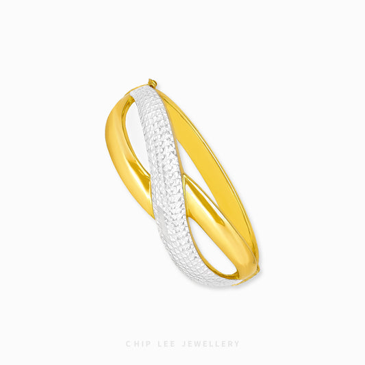 Duo Tone Crossover Bangle by Chip Lee Jewellery Singapore, sculpted 916 gold with matte and high-polish finishes, bold and elegant accessory