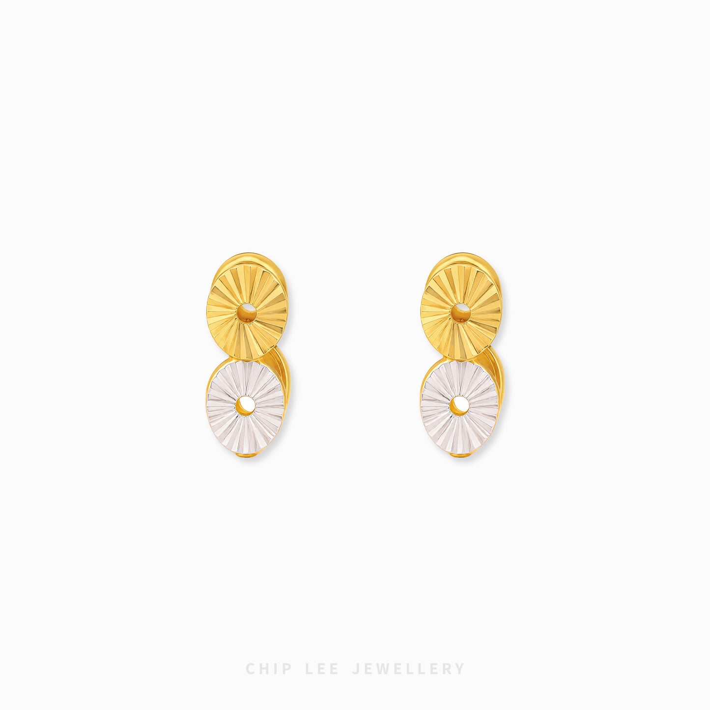 Two-tone hoop earrings with modern disc detailing and contemporary styling.