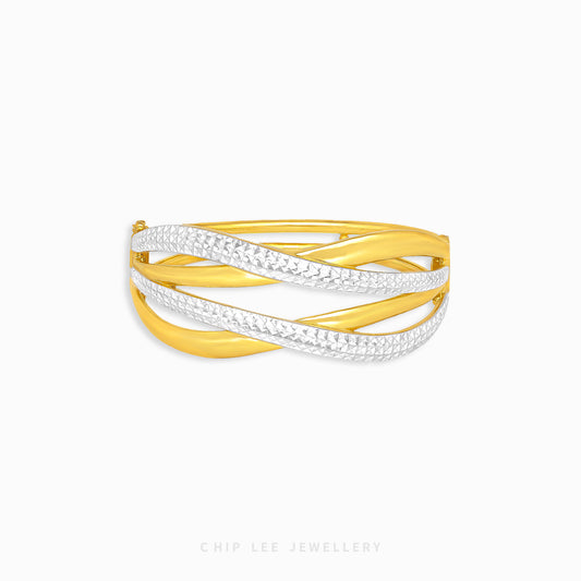 Discover the Duo Tone Duo Crossover Bangle by Chip Lee Jewellery in Singapore. Sculpted 916 gold with matte and high-polish finishes offers bold elegance and unique style.