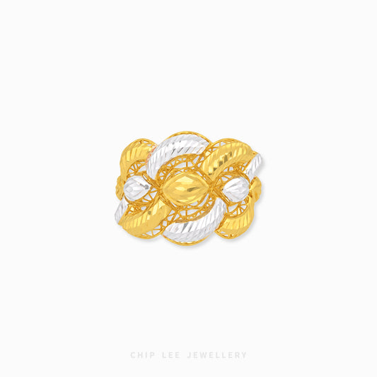 A two-tone gold and silver ring with a textured, knotted floral design, shown on a plain white background with a Chip Lee Jewellery watermark at the bottom.