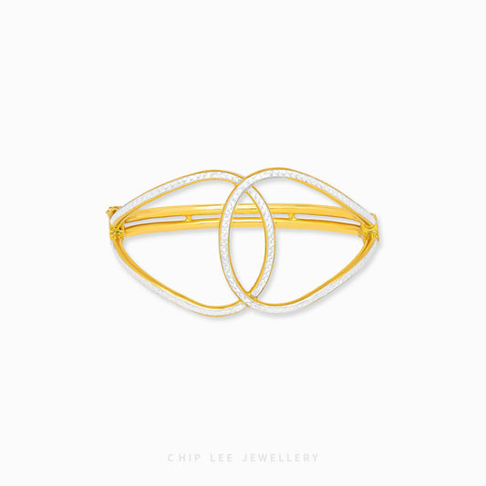 Duo Tone Gold Loop Knot Bangle by Chip Lee Jewellery Singapore, sculpted 916 gold with matte and high-polish finishes, bold and elegant accessory