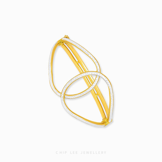 Duo Tone Gold Loop Knot Bangle by Chip Lee Jewellery Singapore, sculpted 916 gold with matte and high-polish finishes, bold and elegant accessory