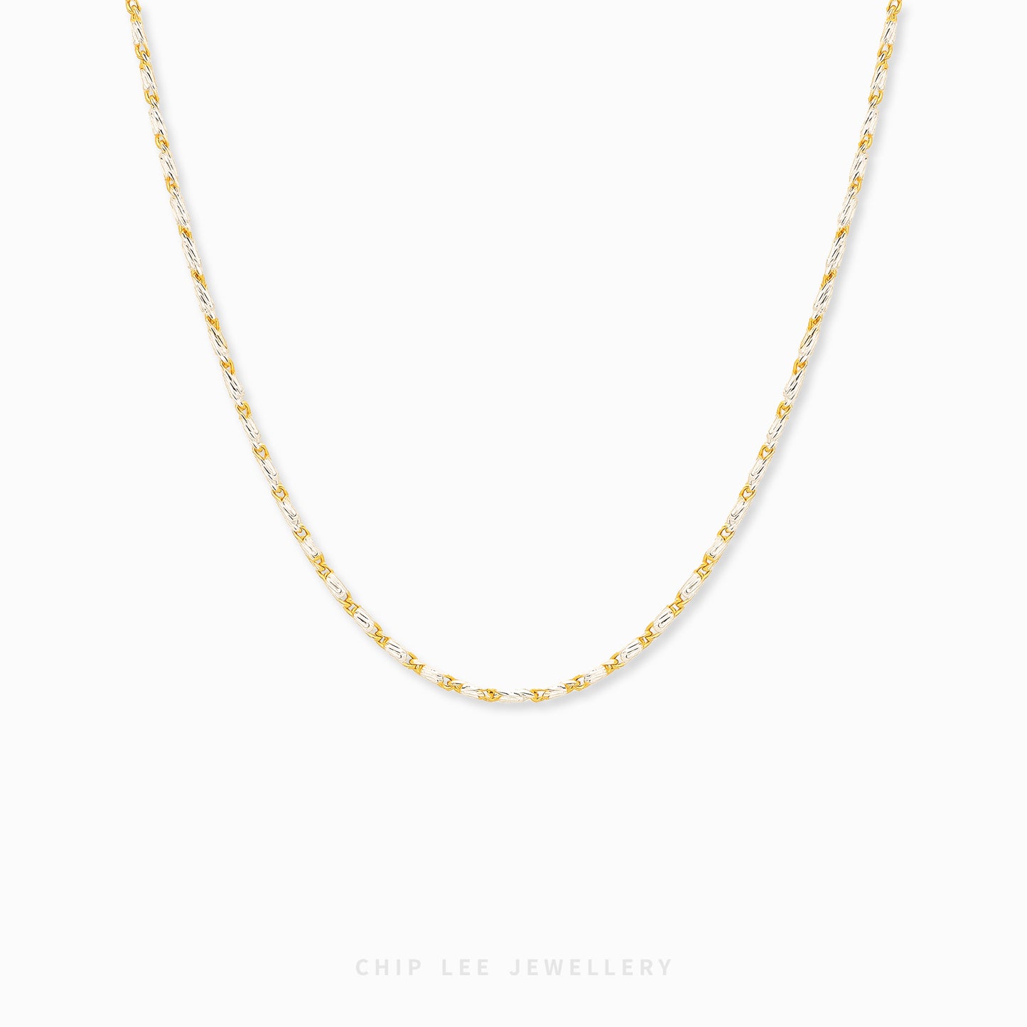 Duo Tone Link Chain Necklace featuring alternating gold and silver-tone links in a modern statement chain design.