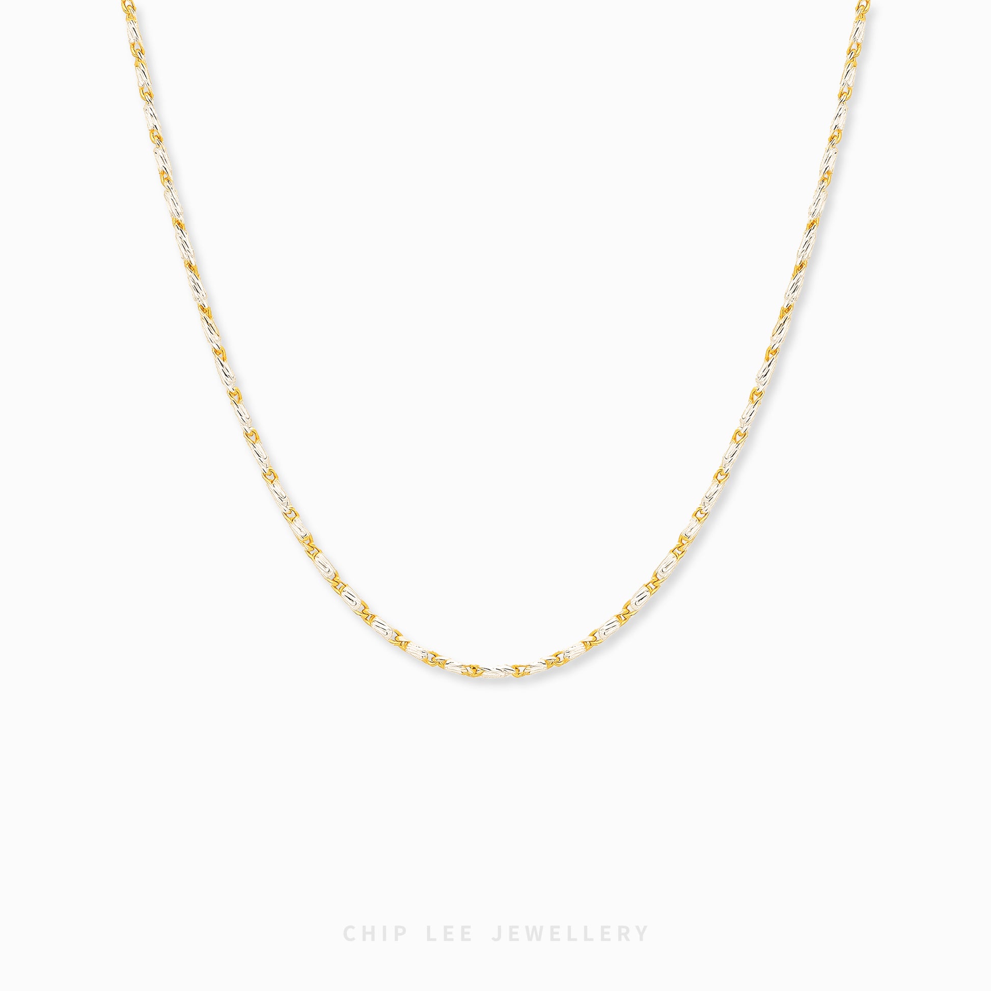 Duo Tone Link Chain Necklace featuring alternating gold and silver-tone links in a modern statement chain design.