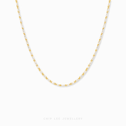 Duo Tone Link Chain Necklace featuring alternating gold and silver-tone links in a modern statement chain design.