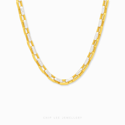 Duo Tone Paperclip Link Chain Necklace featuring polished gold-tone paperclip links with textured white accent links in a contemporary two-tone design.