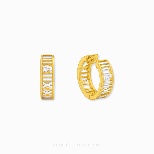 A pair of gold huggie hoop earrings with white Roman numerals, shown from both front and side angles on a light gray background with 'CHIP LEE JEWELLERY' text at the bottom.