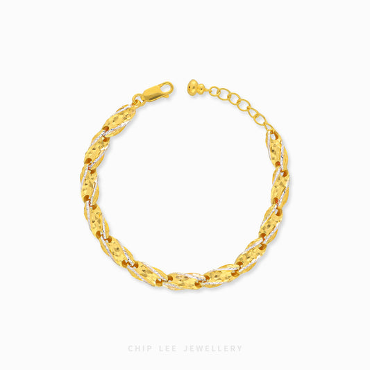 916 gold duo tone Siput bracelet in 22K gold with shell-inspired spiral design
