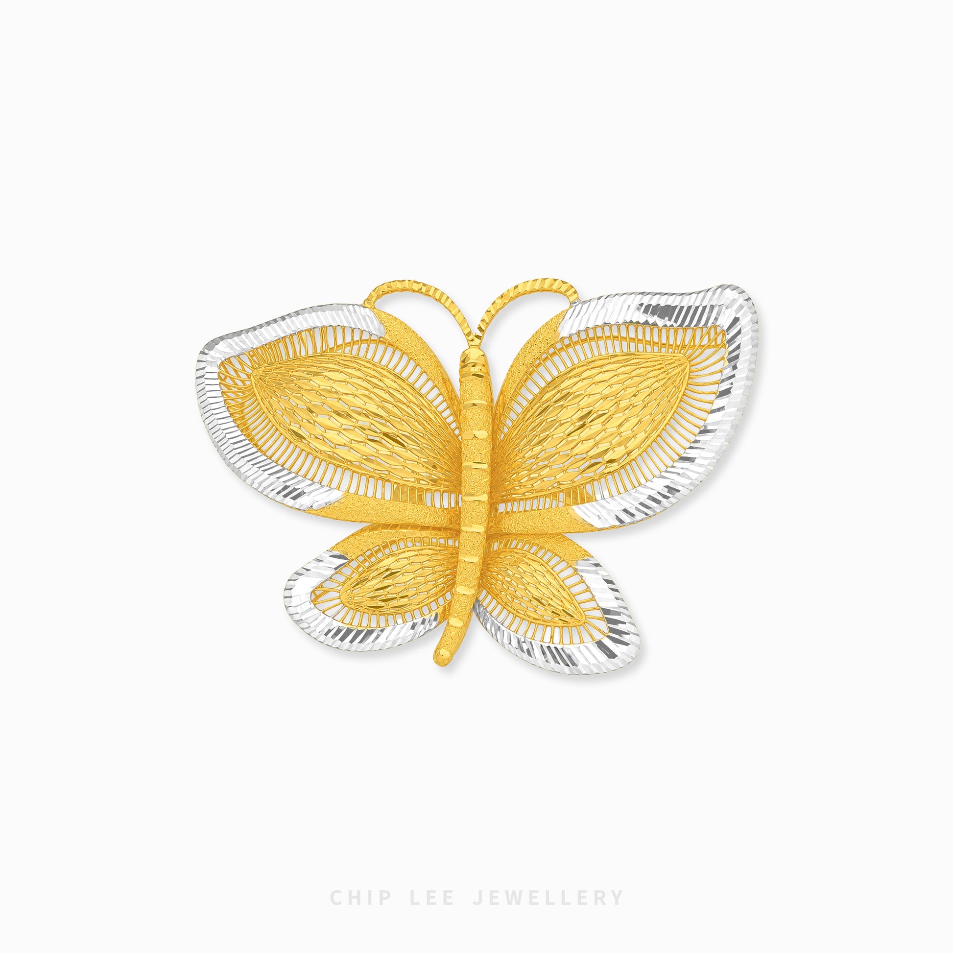 A butterfly-shaped ring by Chip Lee Jewellery, featuring textured yellow gold wings and body with silver-toned outer edges, set against a plain white background.