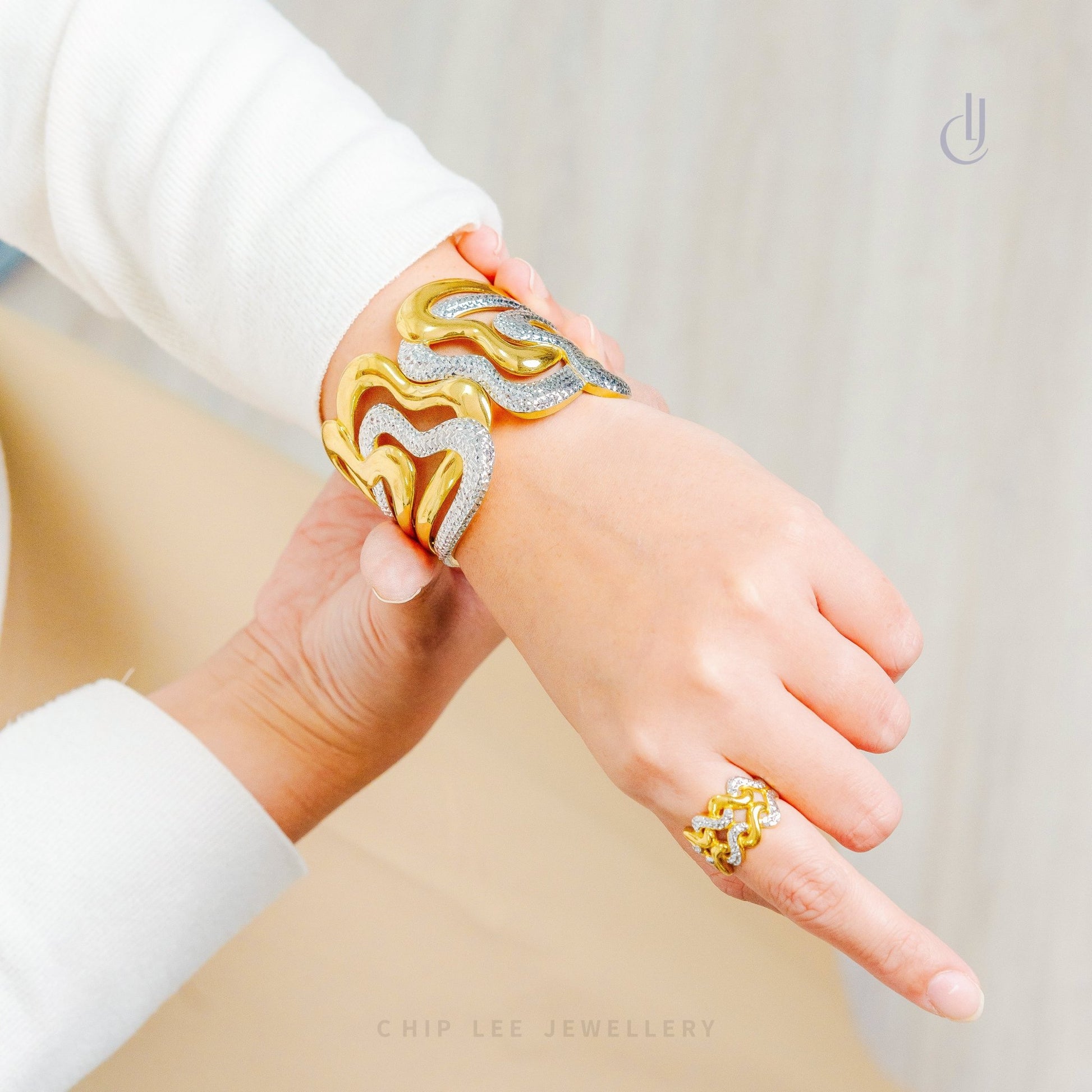Duo Tone Wavy Statement Bangle by Chip Lee Jewellery Singapore, 916 gold with matte and high‑polish finishes, bold and elegant accessory