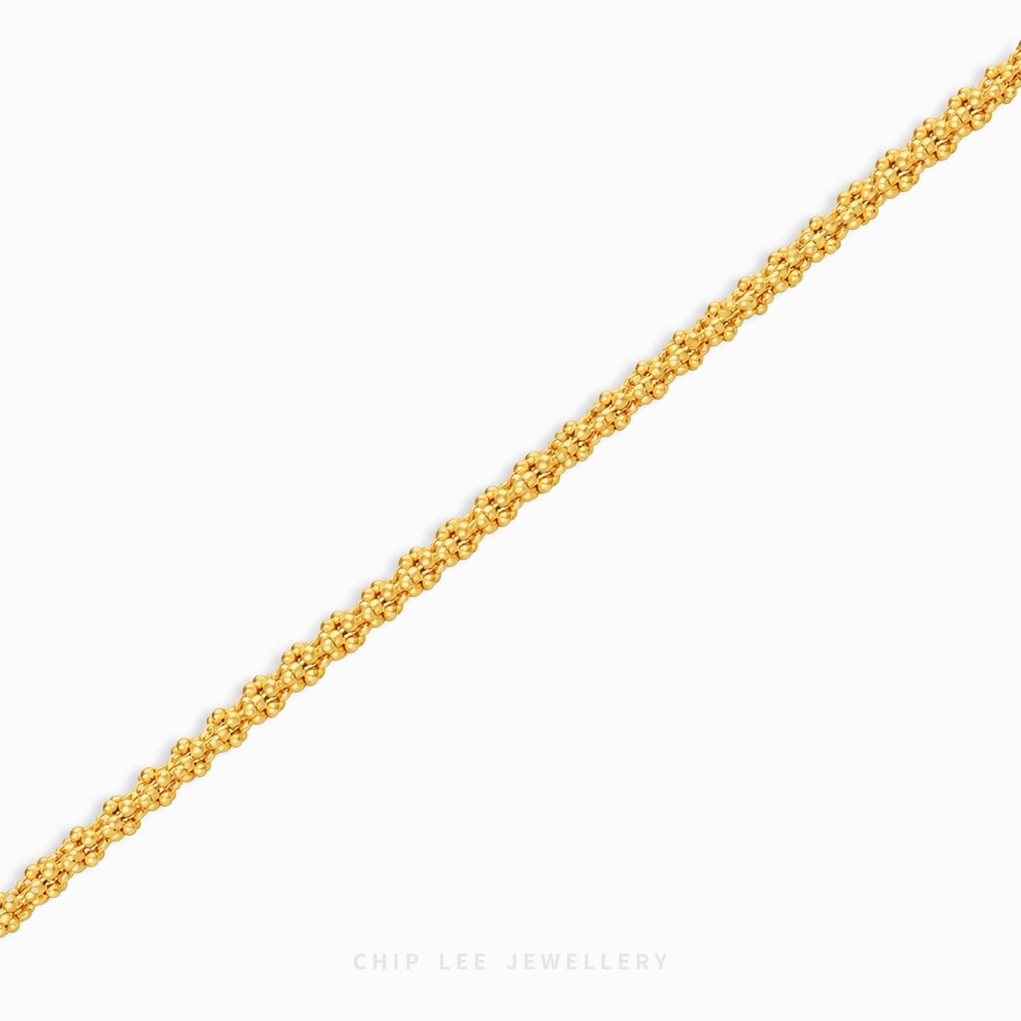 A close-up of a textured yellow gold chain running diagonally across a light gray background, with the brand name 'CHIP LEE JEWELLERY' printed at the bottom.