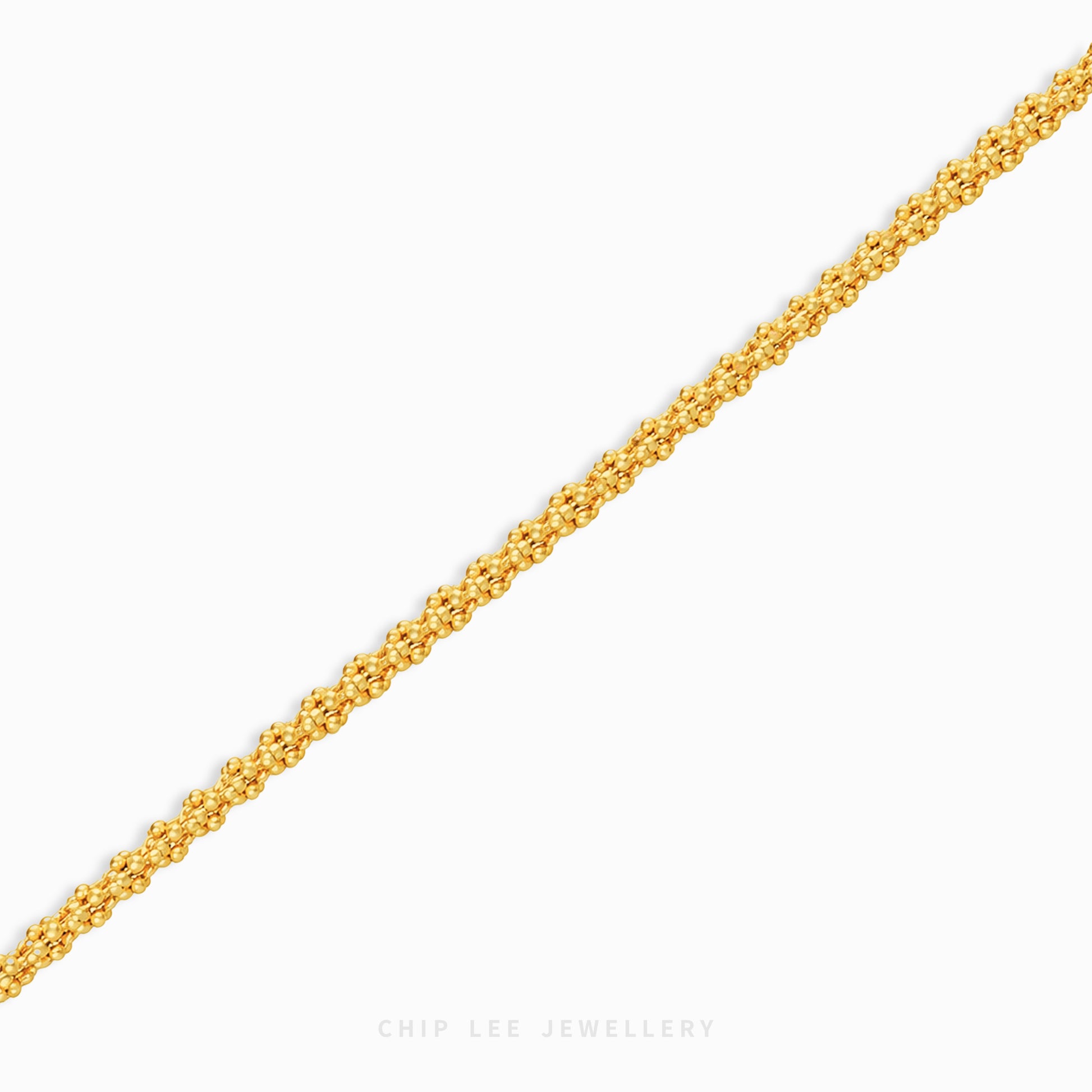A close-up of a textured yellow gold chain running diagonally across a light gray background, with the brand name 'CHIP LEE JEWELLERY' printed at the bottom.