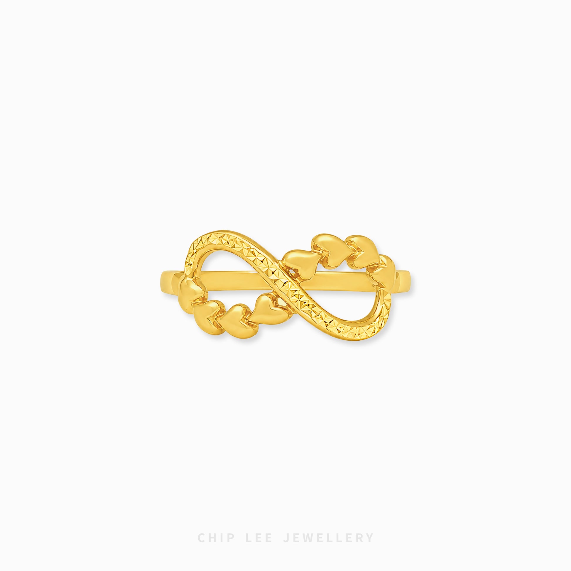 A gold infinity ring featuring a series of small heart links, displayed on a clean white background with the brand name 'CHIP LEE JEWELLERY' printed at the bottom.