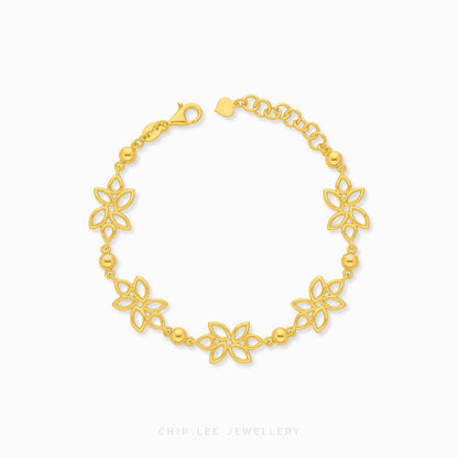 A gold chain bracelet featuring five openwork floral motifs and small polished beads, displayed on a clean white background with the brand name 'CHIP LEE JEWELLERY' printed below.