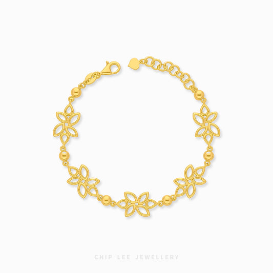 A gold chain bracelet featuring five openwork floral motifs and small polished beads, displayed on a clean white background with the brand name 'CHIP LEE JEWELLERY' printed below.