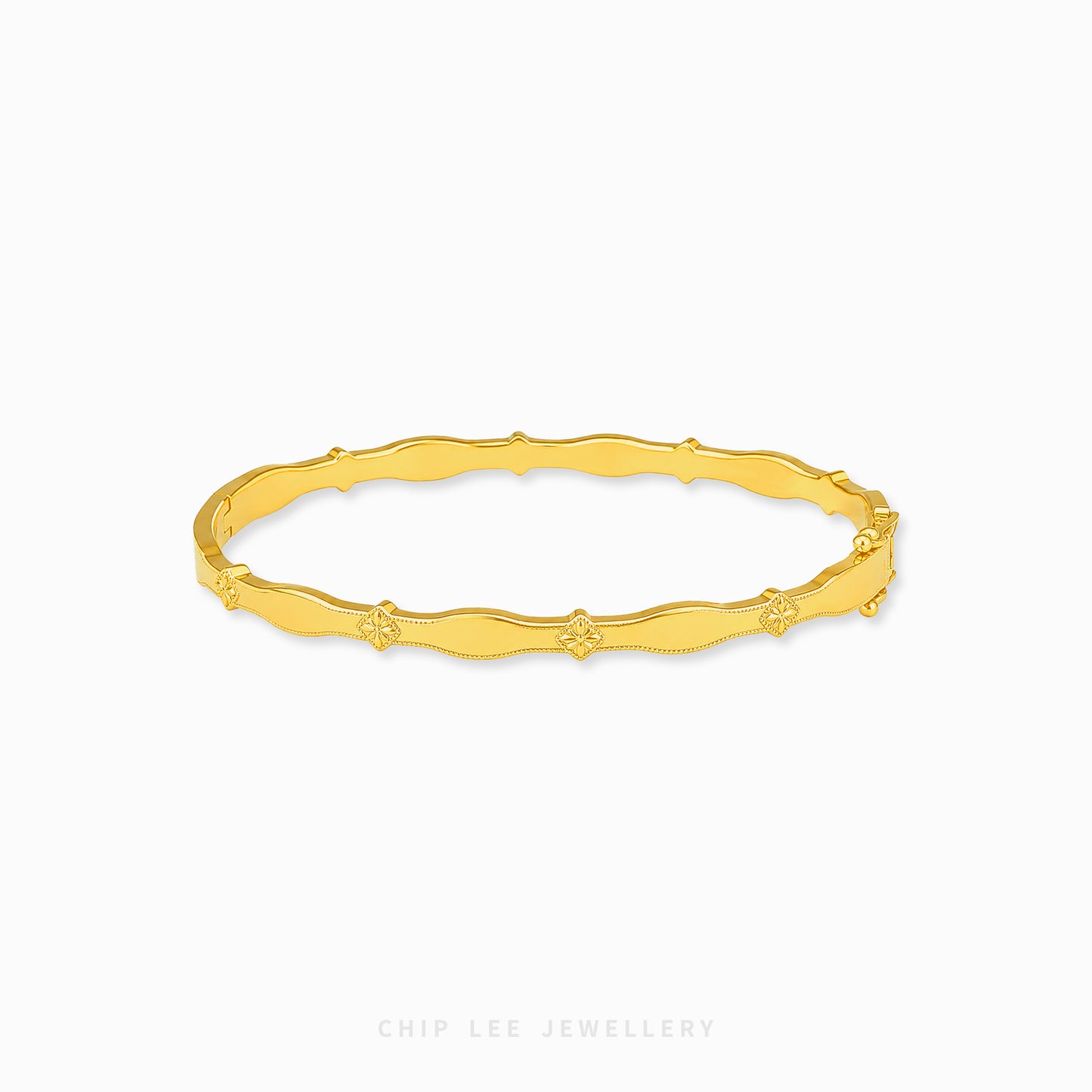 A gold bangle bracelet with a textured, wavy bamboo-inspired design and small star details spaced along the band, shown on a light gray background with the brand name 'CHIP LEE JEWELLERY' at the bottom.