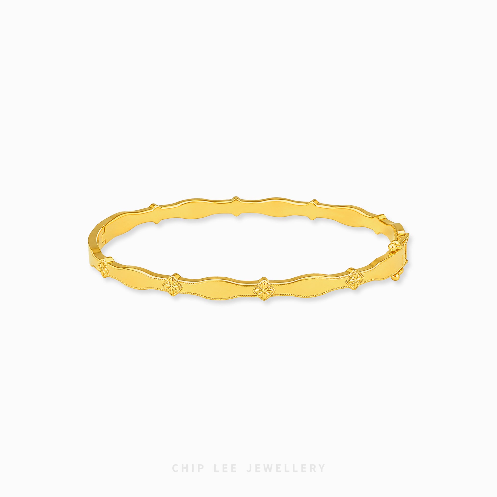 A gold bangle bracelet with a textured, wavy bamboo-inspired design and small star details spaced along the band, shown on a light gray background with the brand name 'CHIP LEE JEWELLERY' at the bottom.