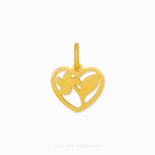Gold heart-shaped pendant with cut-out design on a white background