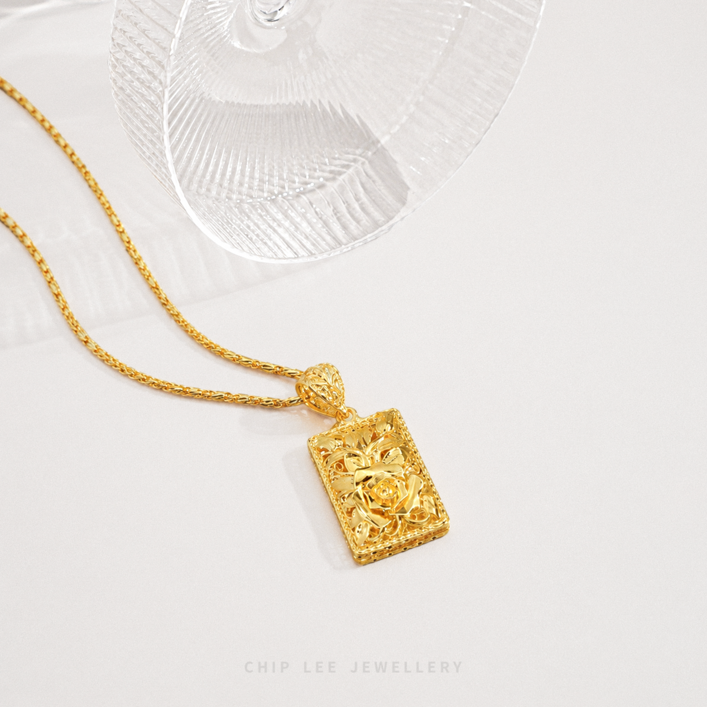 Framed Flower Pendant Necklace featuring a detailed floral design enclosed within an elegant decorative frame