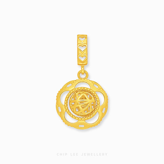 A gold pendant charm featuring a circular filigree design with a central geometric star motif and a heart-patterned bail, shown on a light gray background with the brand name 'CHIP LEE JEWELLERY' at the bottom.