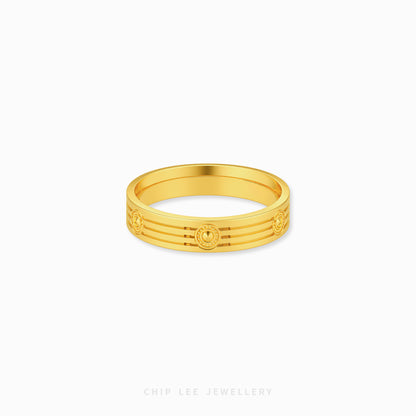 A gold band ring with a textured, ridged outer surface and circular medallion details, shown on a clean white background with 'CHIP LEE JEWELLERY' text at the bottom.