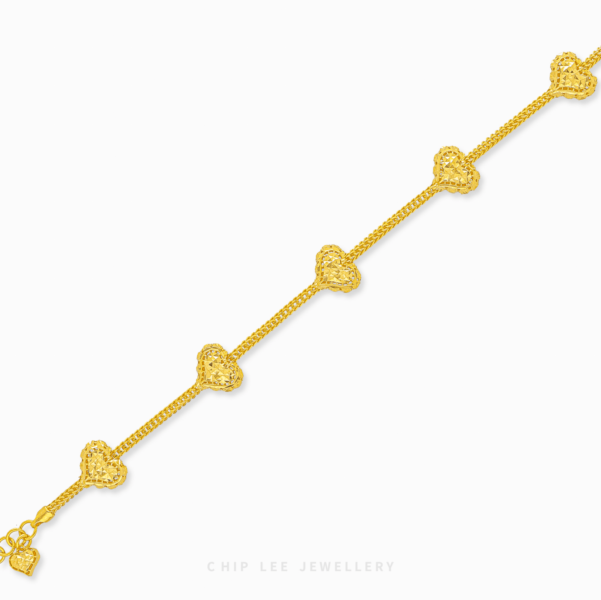 Heart Charm Bracelet in 916 gold. Subtle, symbolic heart design perfect for stacking or a timeless statement.