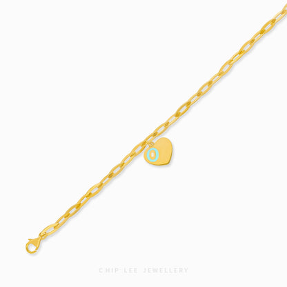 Dainty heart charm bracelet adorned with turquoise enamel detail, certified and hallmarked by Singapore Assay Office for purity and authenticity.