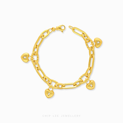 Gold bracelet with heart charms on a white background, branded 'Chip Lee Jewellery'.