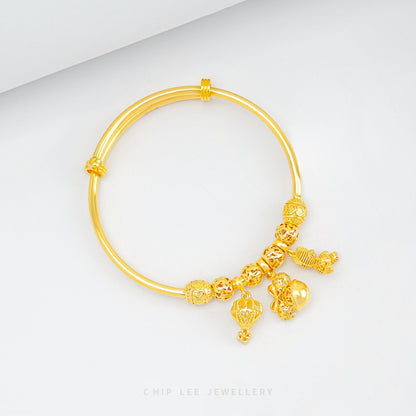 Hot Air Balloon, Minnie Mouse, Bear Charms Baby Bangle in 916 gold by Chip Lee Jewellery, symbolizing joy and elegance for your child's milestone.