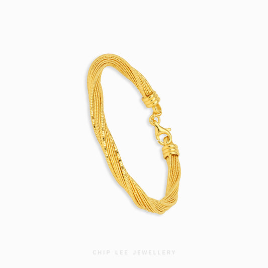 A gold-toned multi-strand snake chain bracelet with a lobster clasp, displayed on a clean white background with a subtle shadow.