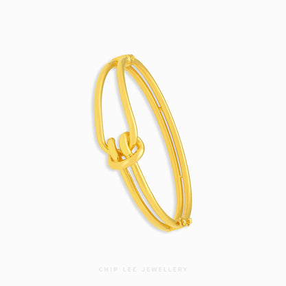 Knot Bangle Bracelet featuring an elegant knot centerpiece and sleek bangle design