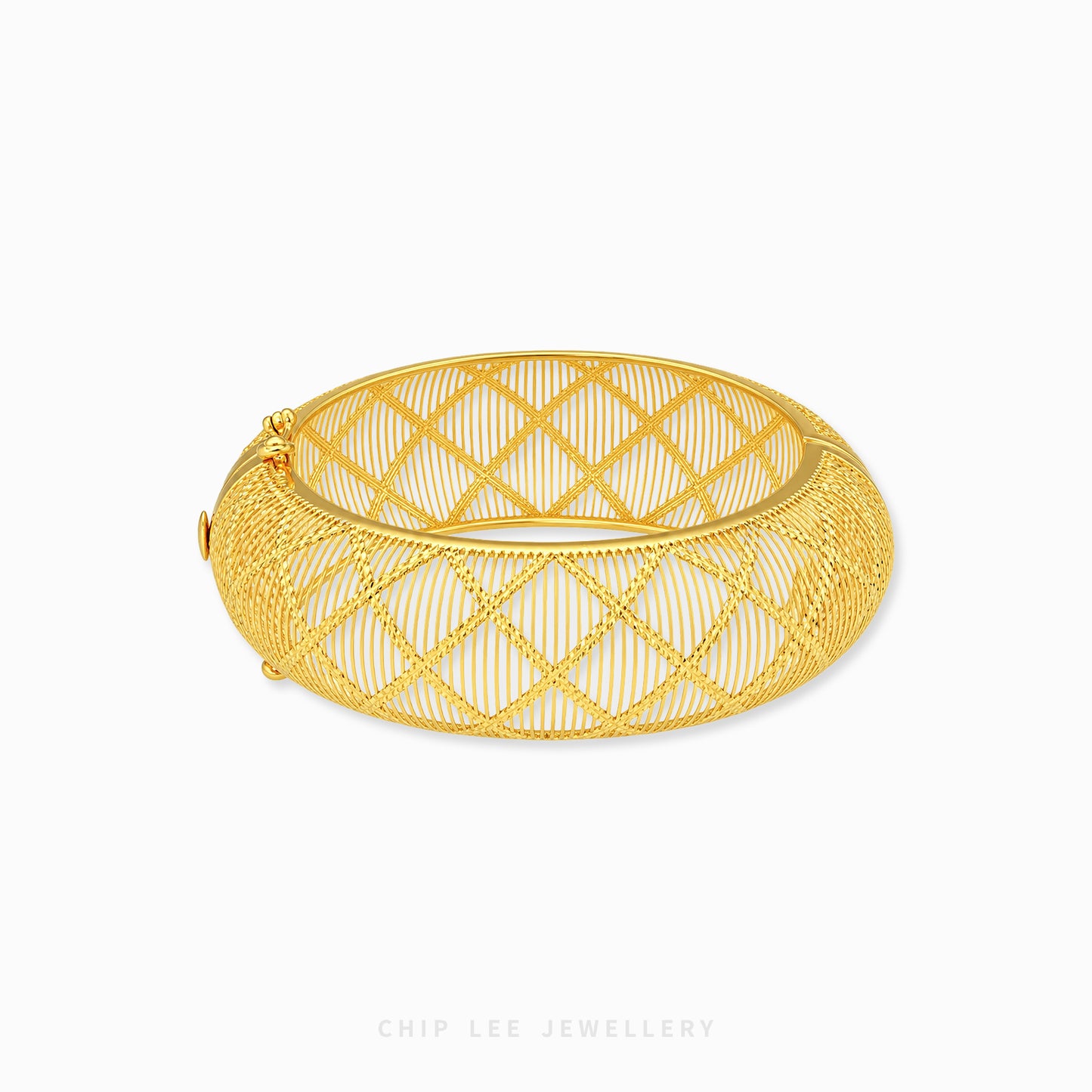 A gold bangle bracelet with a geometric openwork wire design, displayed on a clean white background with a brand watermark at the bottom.