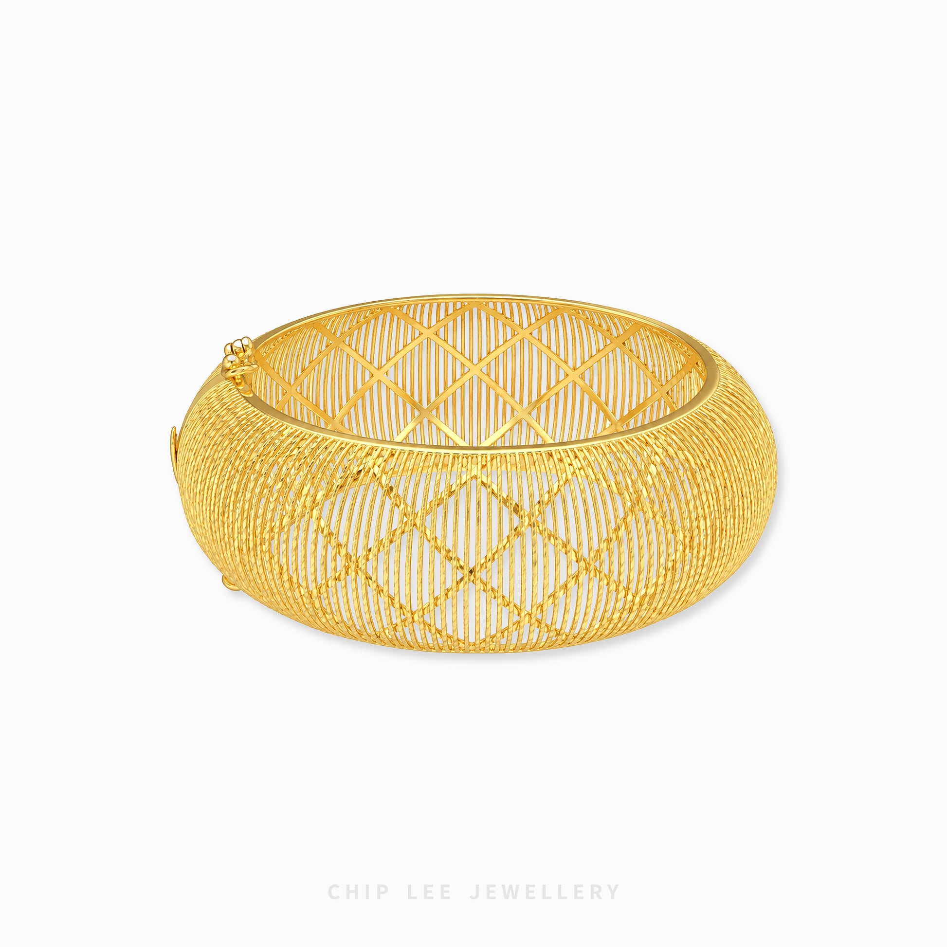 A gold-toned open bangle bracelet with a geometric diamond-patterned wire mesh design, shown on a clean white background with a Chip Lee Jewellery watermark at the bottom.