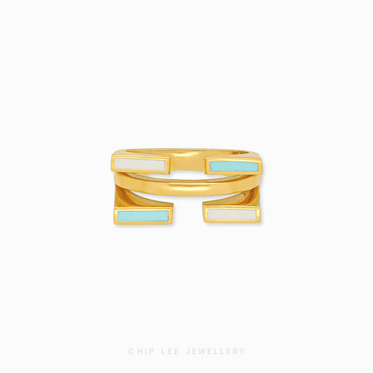 916 solid gold with white and blue enamel. Hallmarked by Singapore Assay Office for certified gold purity.