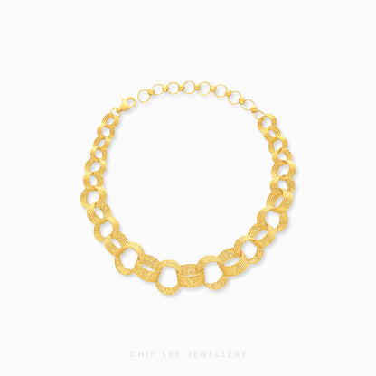 A gold bracelet with a chain link design.