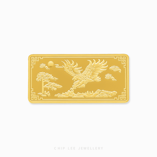 Gold bar with engraved design of a bird and landscape on a white background, branded 'Chip Lee Jewellery'.