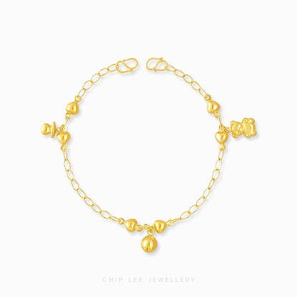 Mixed Charm Baby Anklet 1 with pacifier, bell, and bear charms in 916 gold by Chip Lee Jewellery Singapore