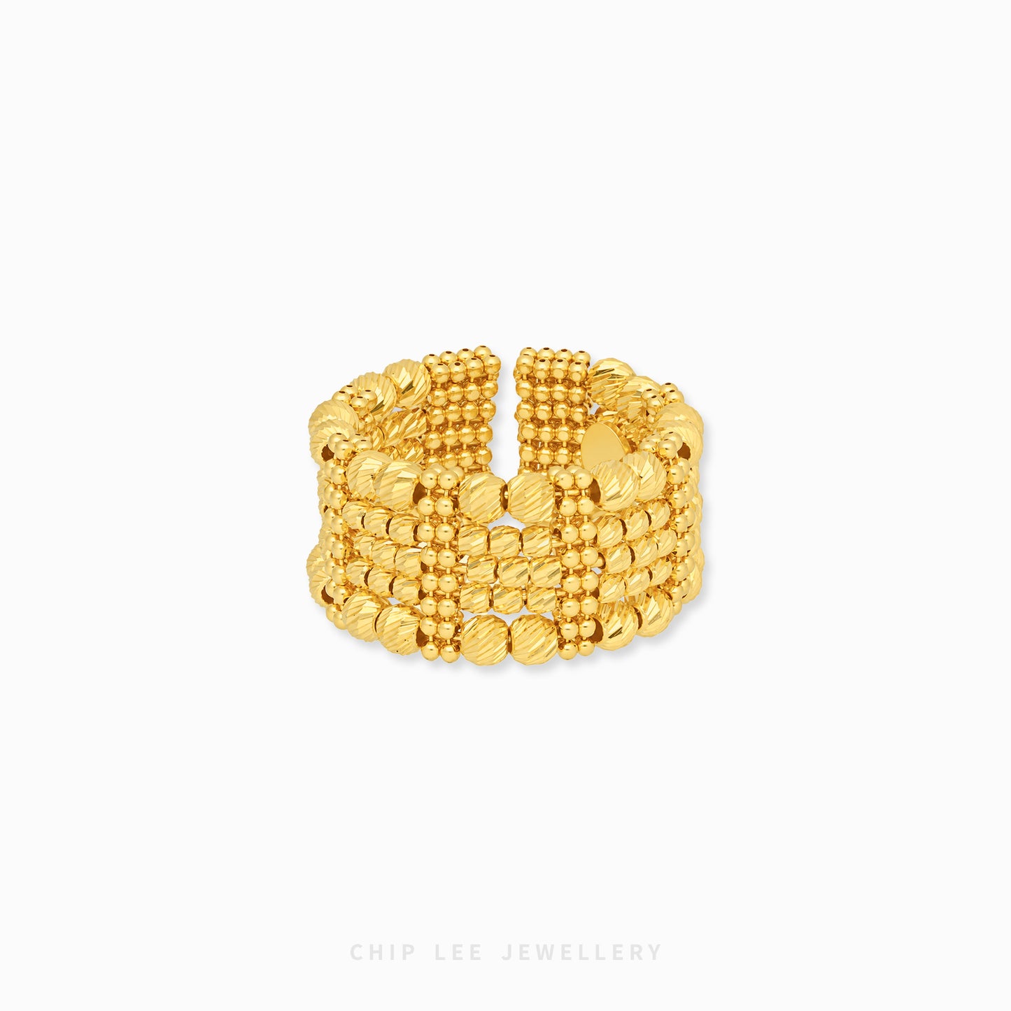 A wide, multi-strand gold ring with textured beaded and ribbed bands, displayed on a clean white background with a subtle shadow.