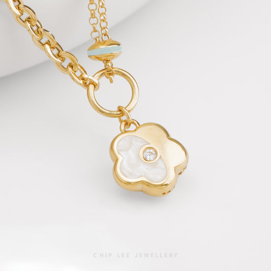 Mother-of-Pearl Enamel Flower Pendant in solid 916 gold with exquisite floral design, hallmarked in Singapore for certified purity and 
authenticity.