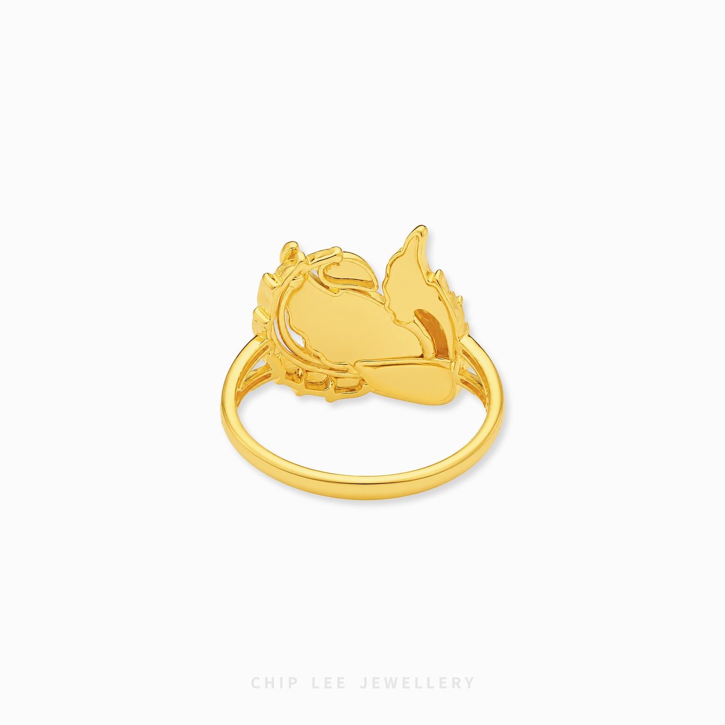 Gold phoenix-inspired statement ring featuring intricate feather detailing and an openwork mythical bird design with a polished luxurious finish.