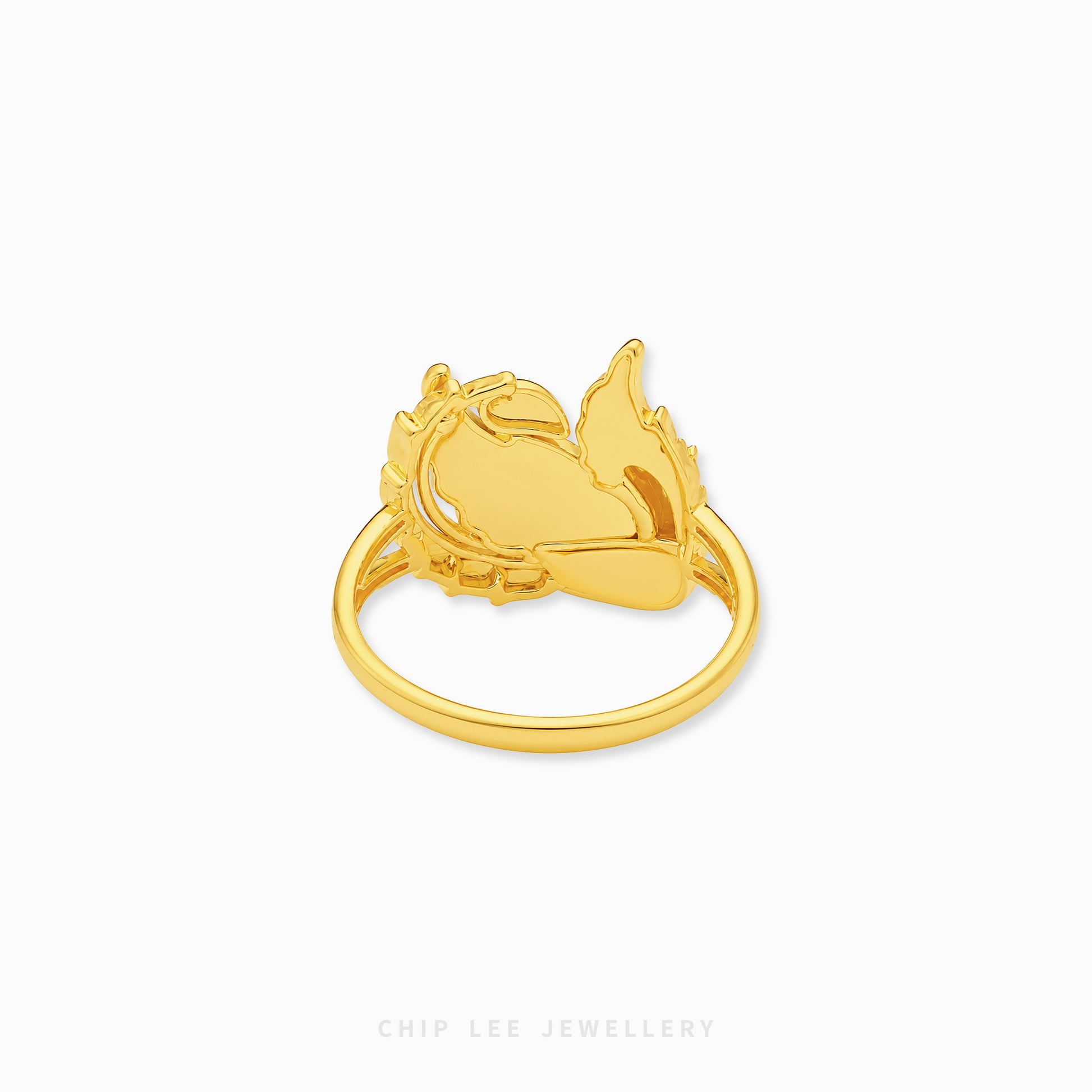 Gold phoenix-inspired statement ring featuring intricate feather detailing and an openwork mythical bird design with a polished luxurious finish.